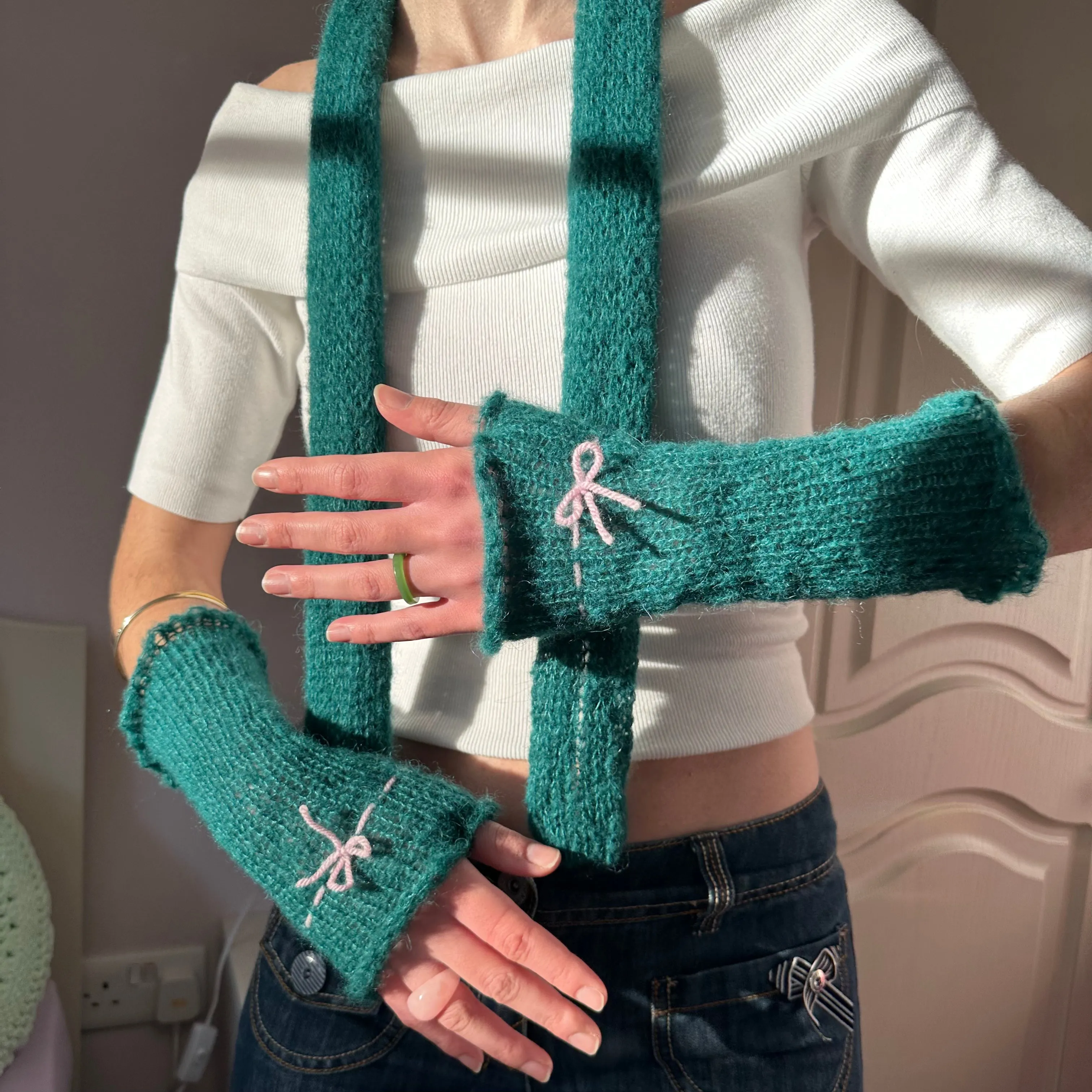 Handmade knitted mohair bow gloves in emerald green and baby pink - with thumb hole