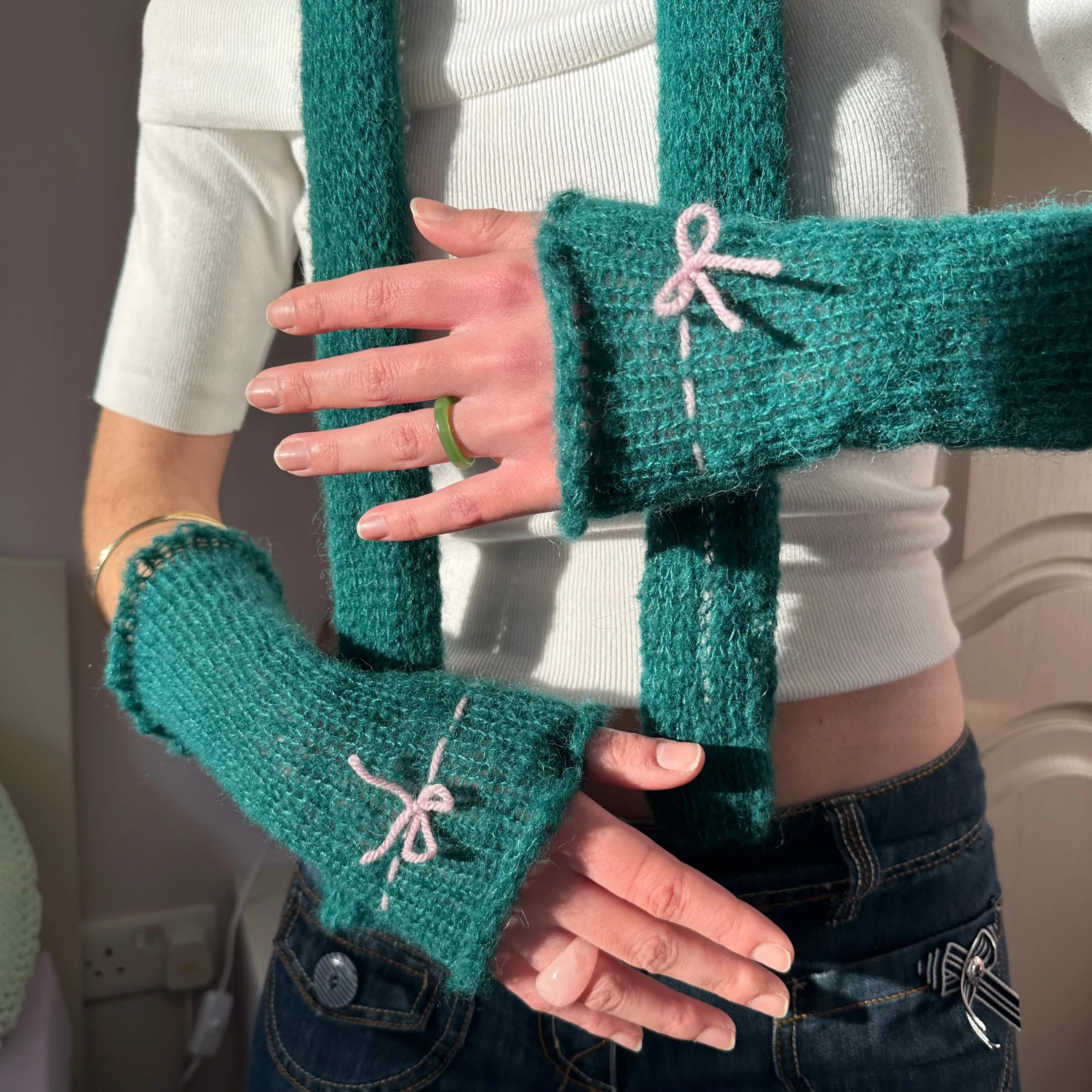 Handmade knitted mohair bow gloves in emerald green and baby pink - with thumb hole